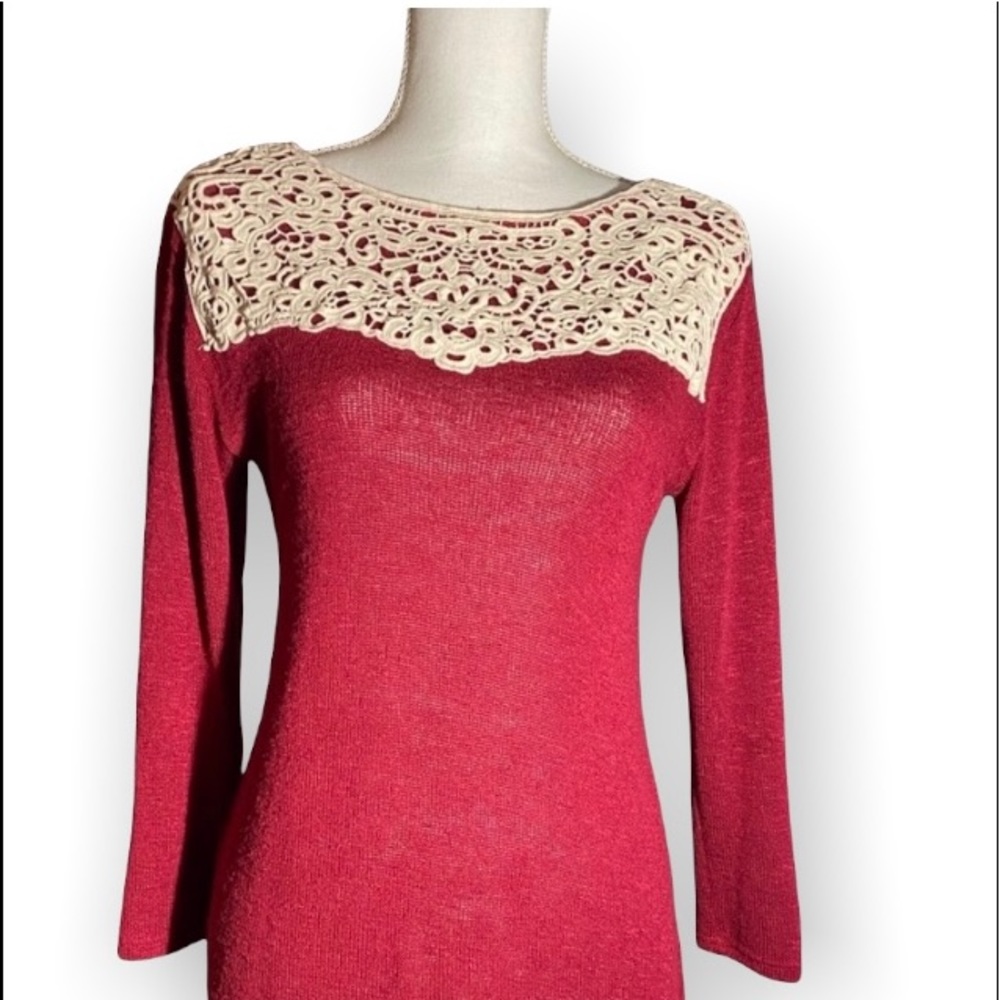 Deep red sweater with creamy lace across shoulders